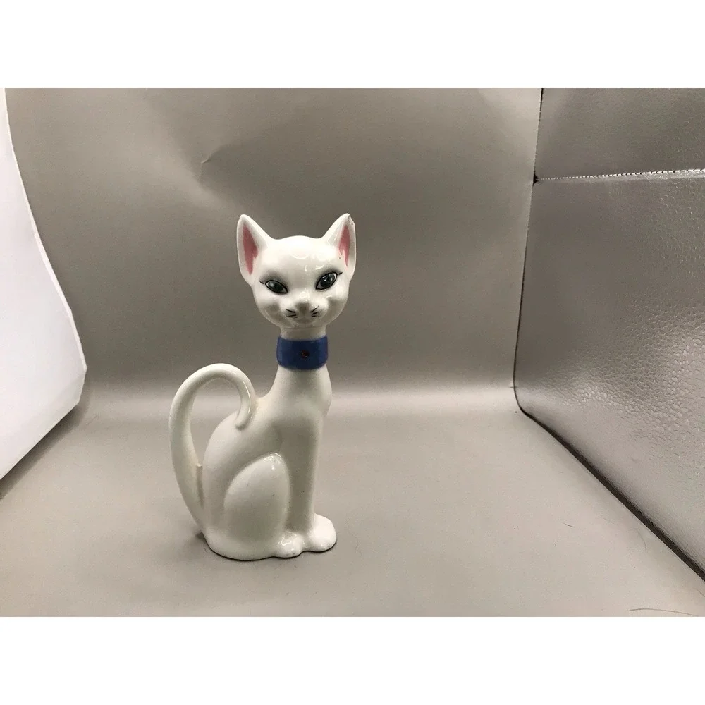 Pretty White Porcelain‎ Kitty With Green Eyes And A Blue Collar
